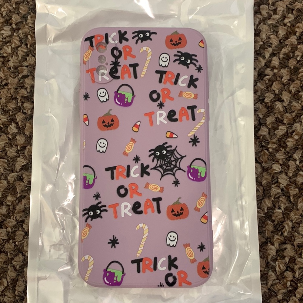 Halloween trick or treat light purple apple iPhoneX case. Pumpkin ghost spider